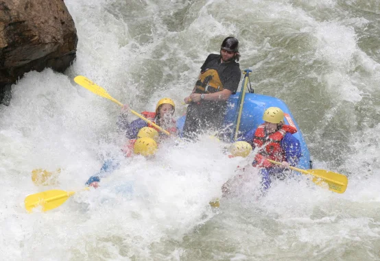 group of people whitewater rafting